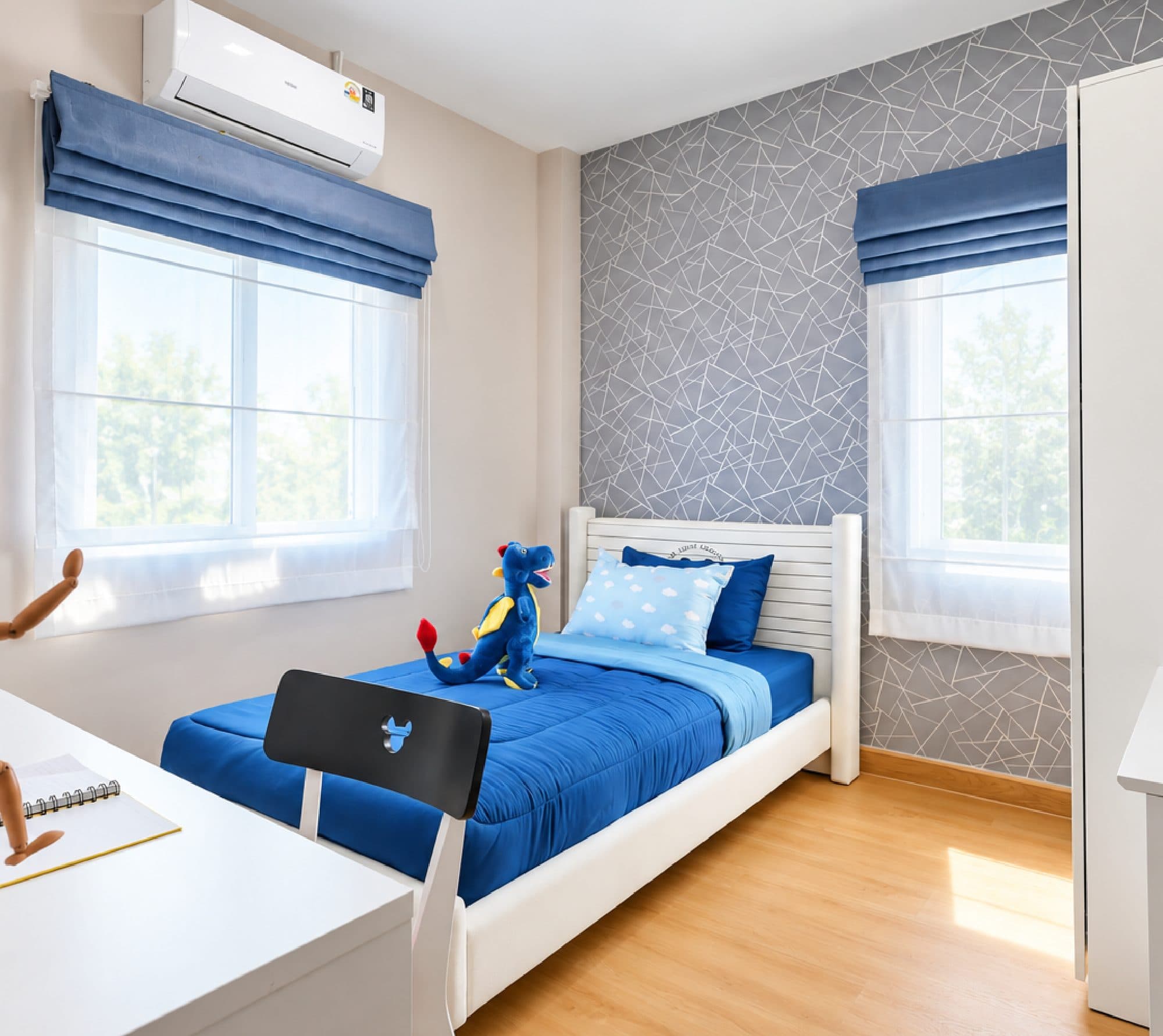 Child’s bedroom with blue bedding and a study desk.
