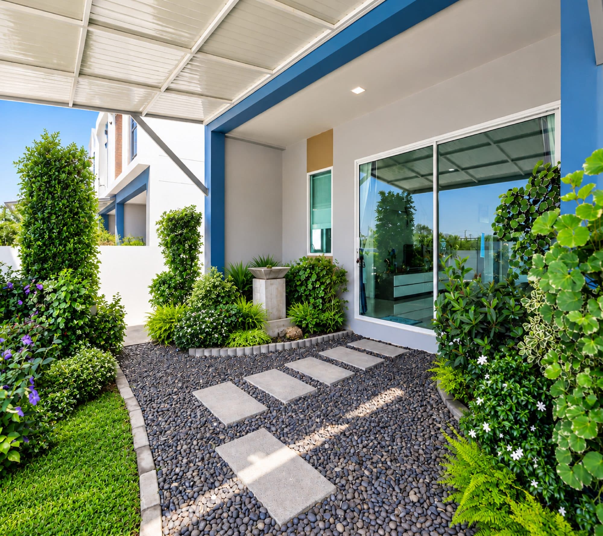 Stepping-stone path through the front garden to the sliding glass doors.