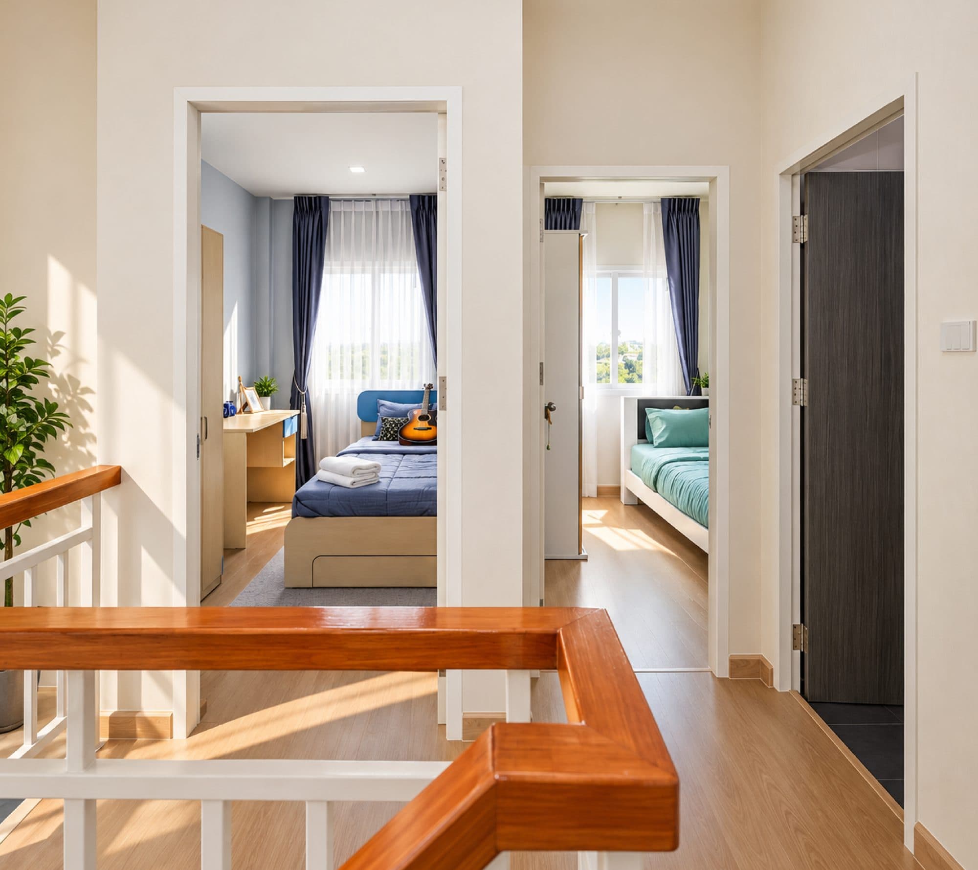 The upstairs landing, looking into two bedrooms.