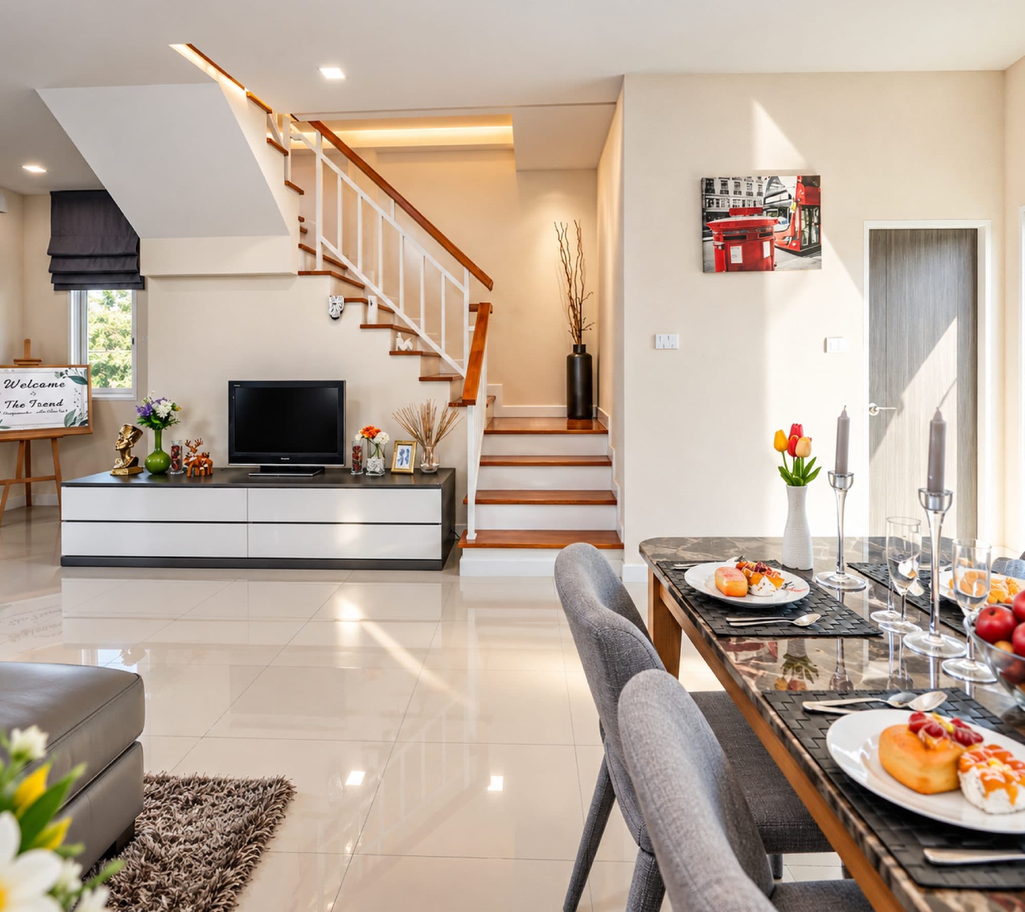 The ground-floor living and dining space, with the stair.